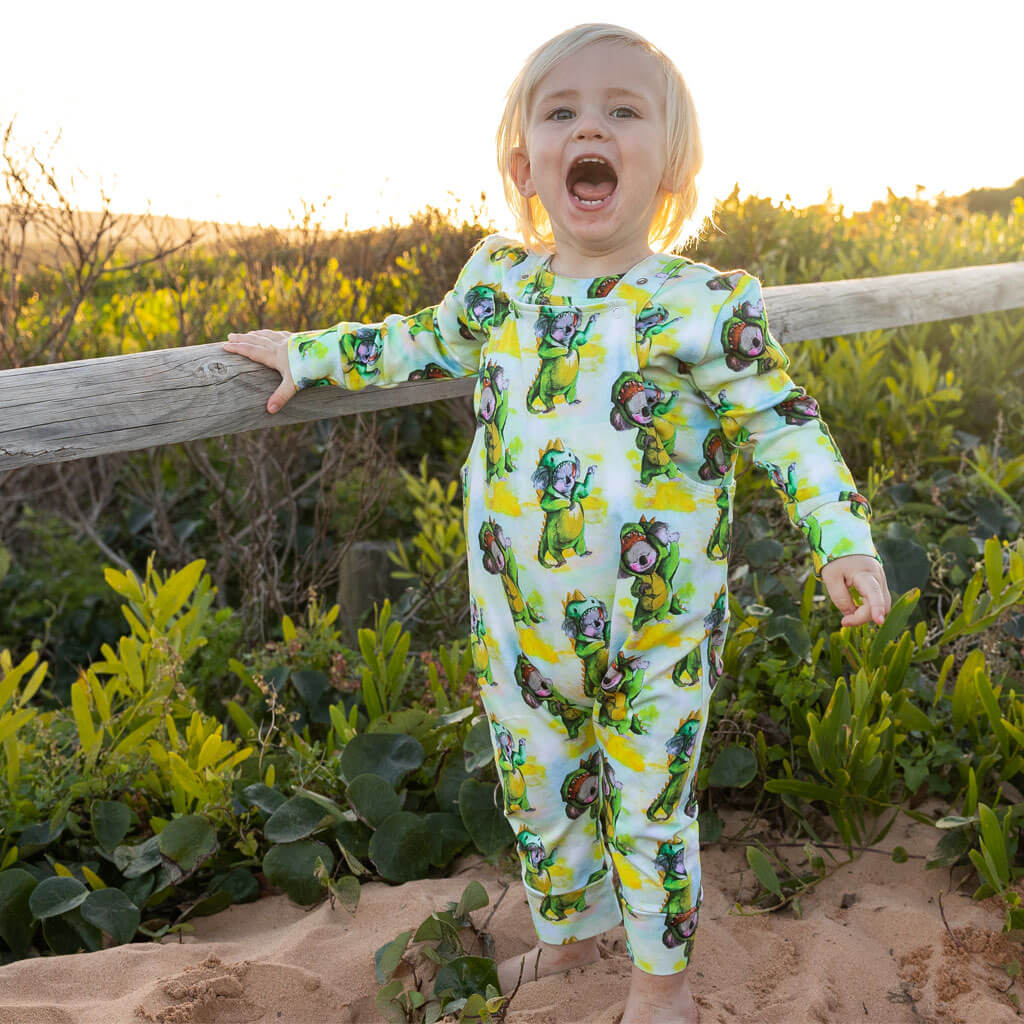 Little Boy Wearing Dinosaur Koala Long Leg Overalls