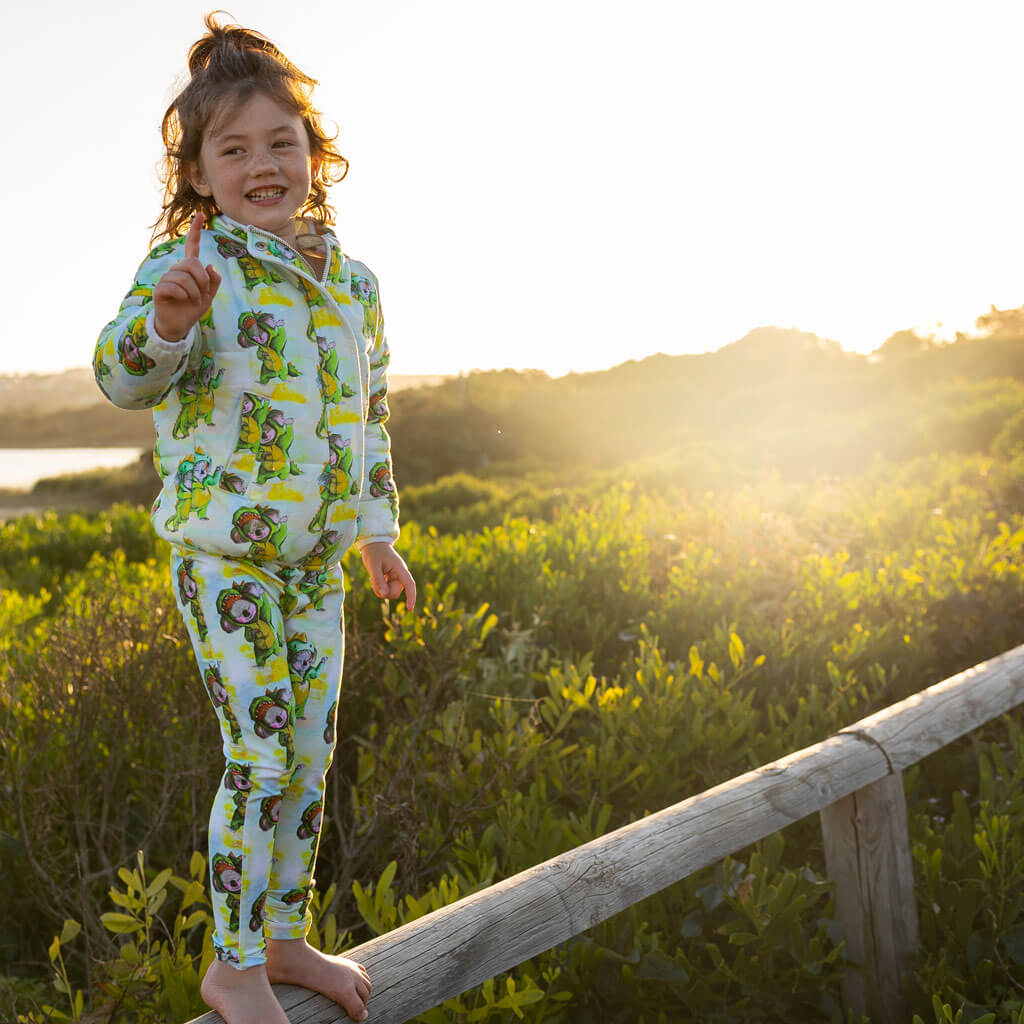 Girl Standing On Fence Wearing Dinosaur Koala Kids' Leggings