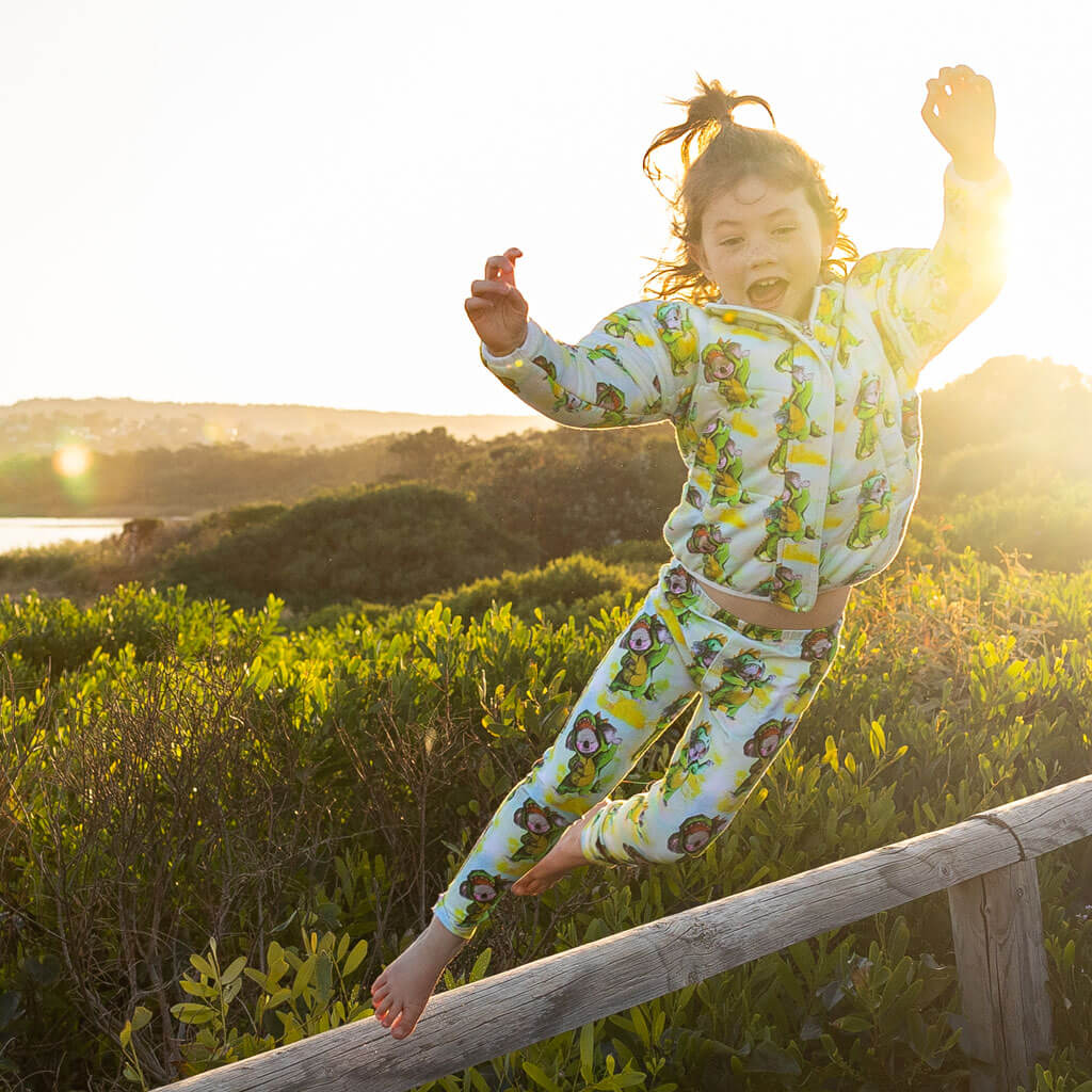 Girl Jumping Wearing Dinosaur Koala Kids' Leggings