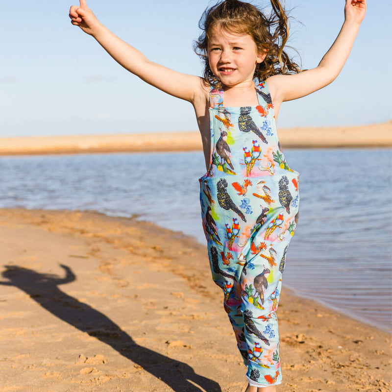 Girl At Beach Wearing Feathered Friends Long Leg Overalls