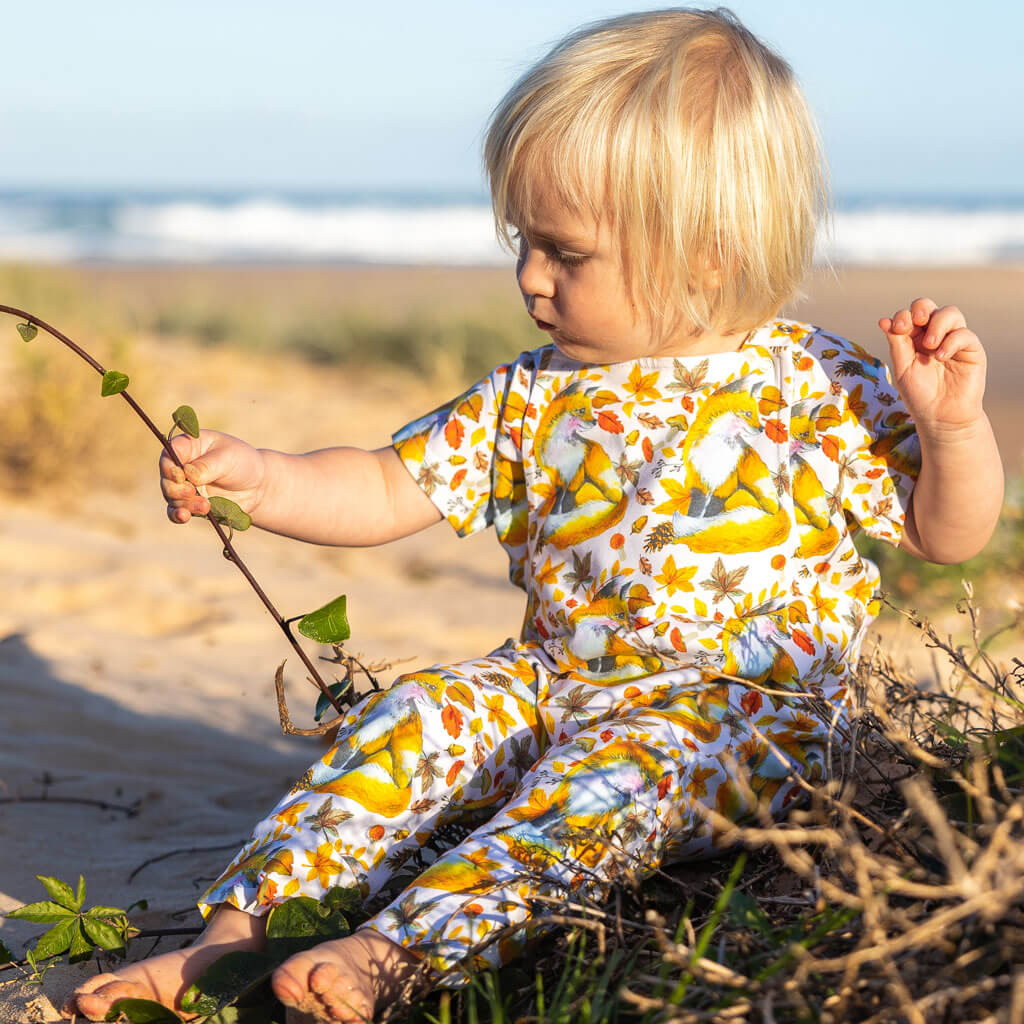 Little Boy Sitting Wearing Maple Fox Short Sleeve Tee With Matching Overalls