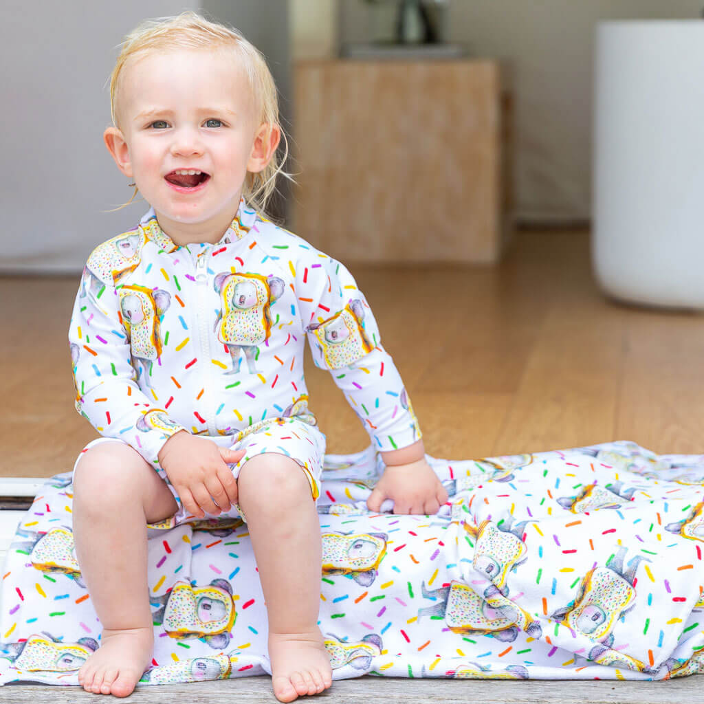 Toddler Sitting Wearing Fairy Bread Koala Unisex Long Sleeve Zip Swimmers