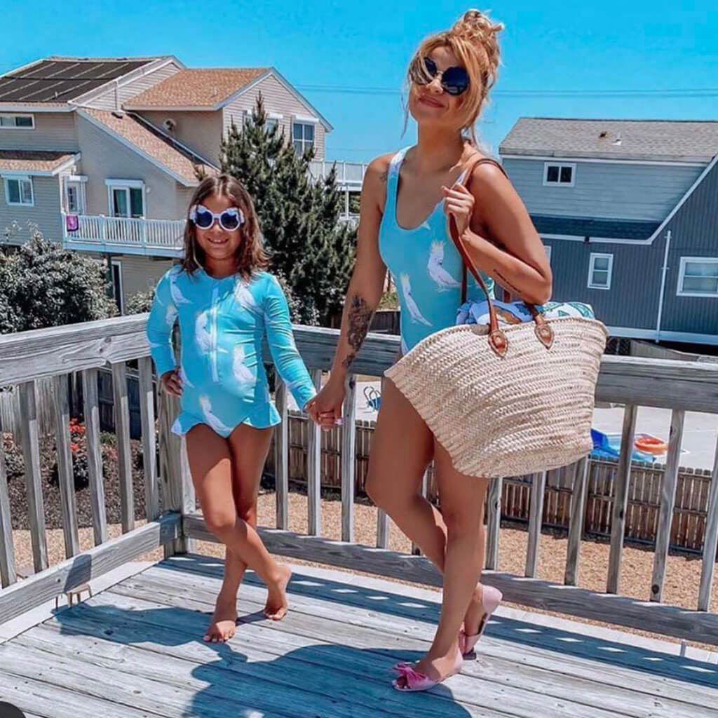 Woman Standing On Deck With Girl While Wearing Green Cockatoo Women's One Piece Swimmers