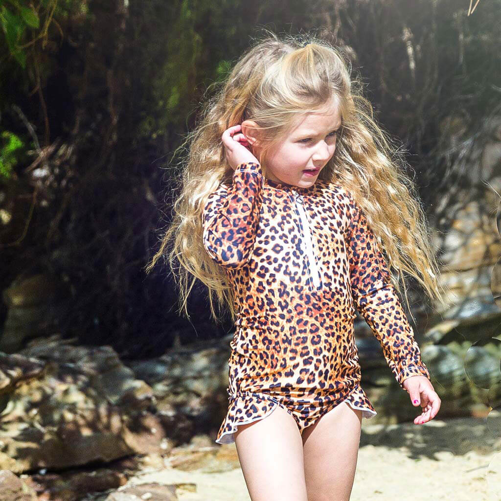 Girl At Beach Wearing Leopard Print Long Sleeve Girls Zip Swimmers