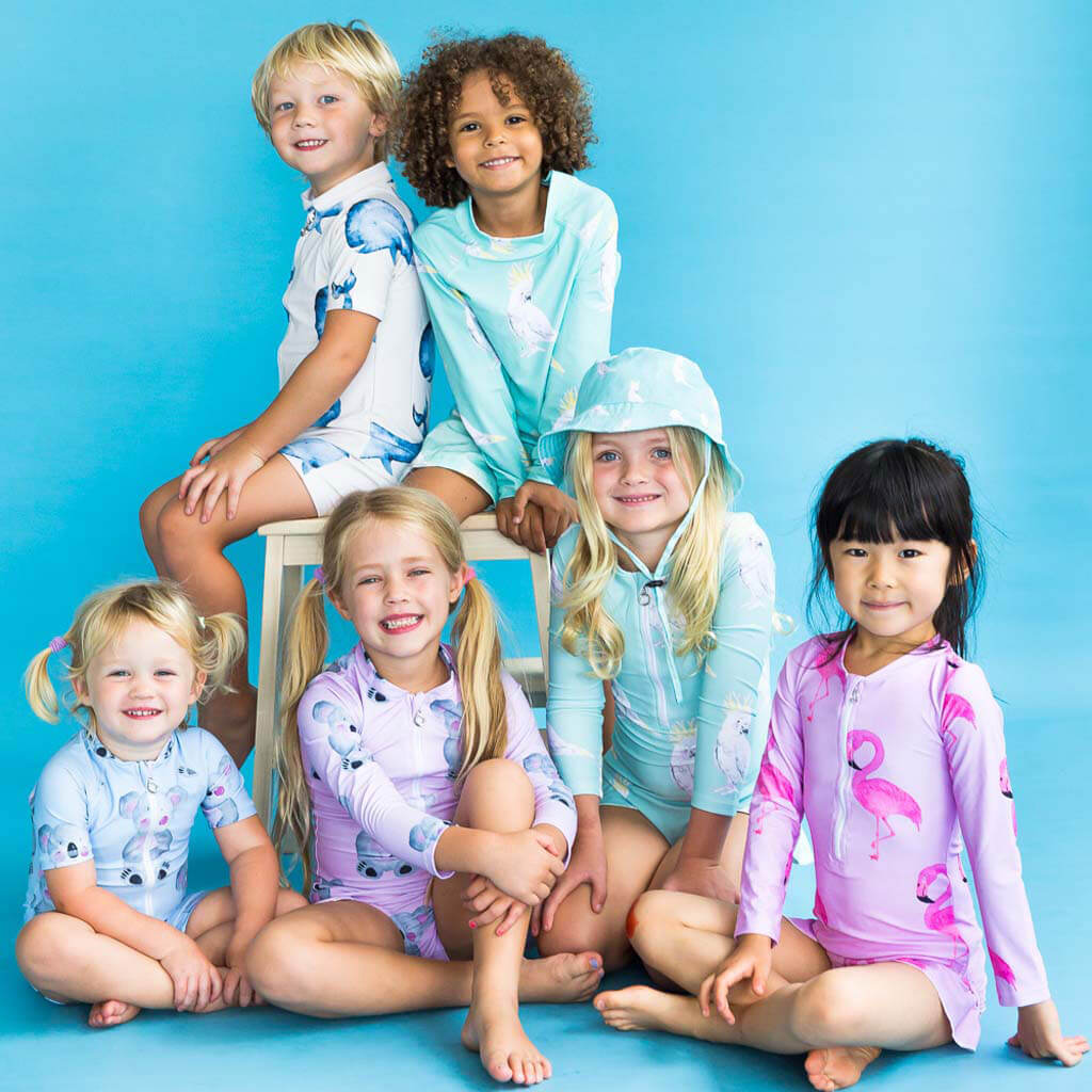 Girl Sitting With Group Of Kids While Wearing Pink Koala Girls Long Sleeve Zip Swimmers