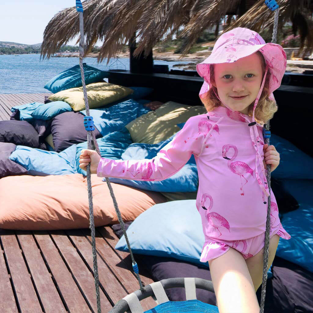 Girl On Swing Wearing Flamingo Kids' Rash Top